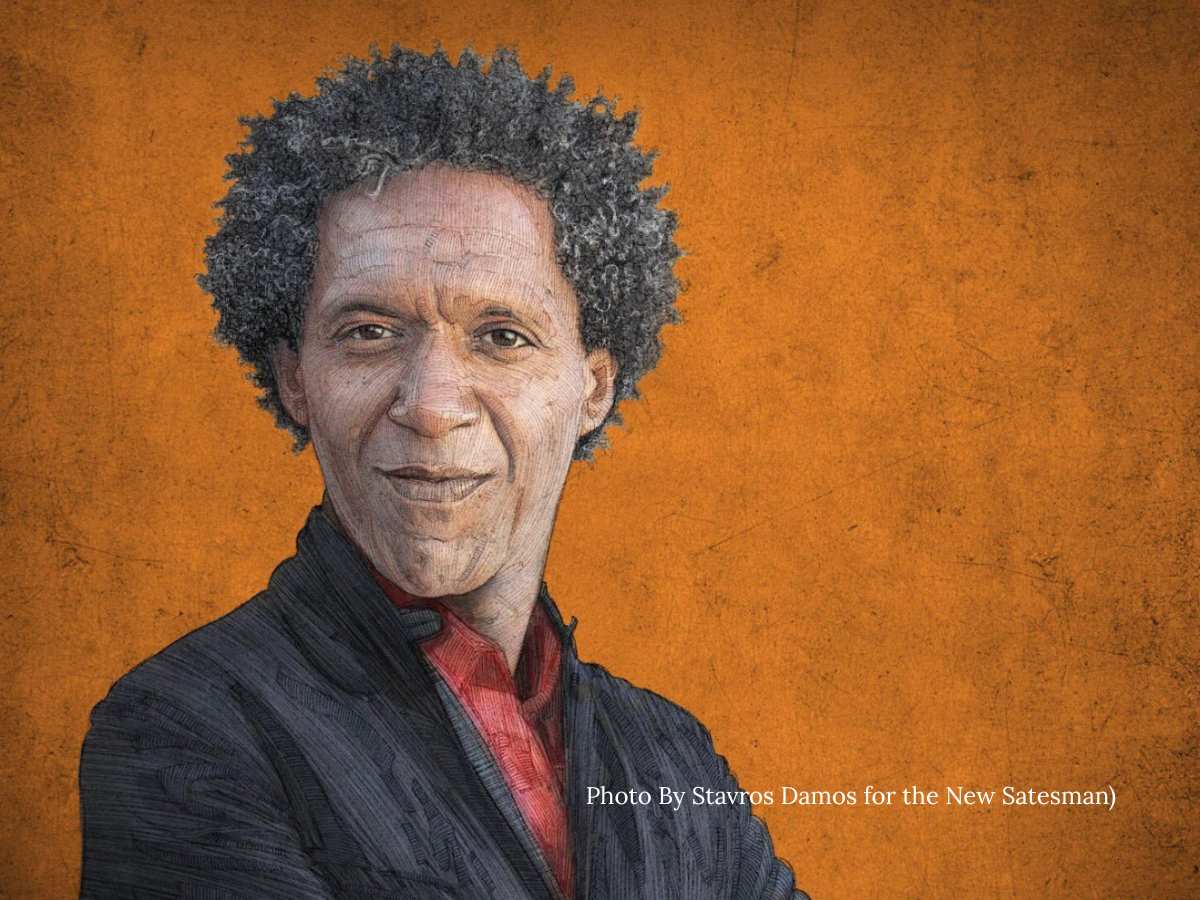 unique wedding reading for romantics An older black man with a curious wry smile and intelligent eyes against a textured burnt orange backdrop. He is wearing a jacket and has a cropped afro.