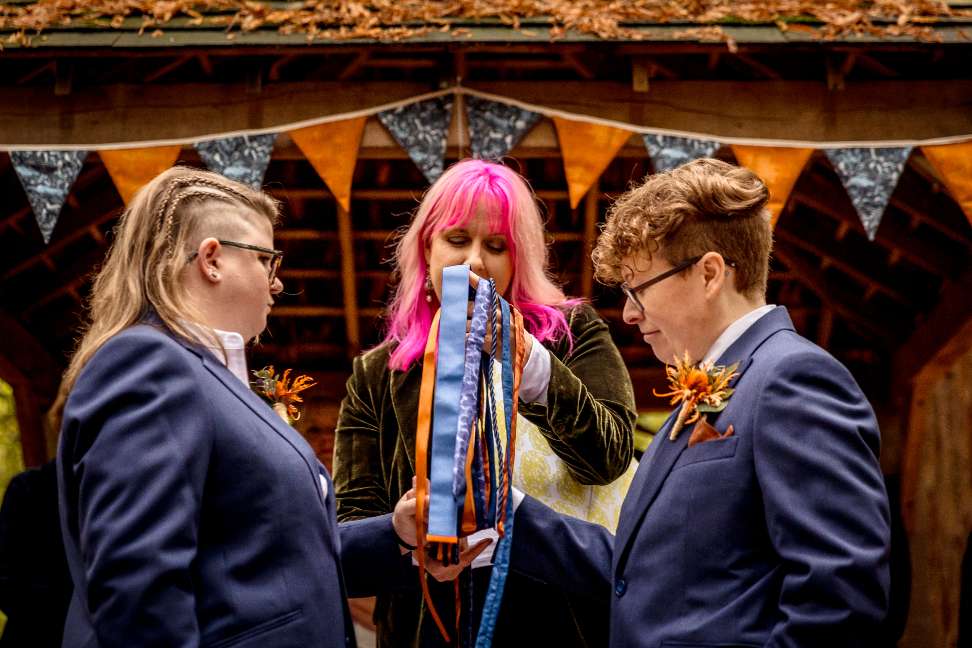 Wedding celebrant leading a handfasting ceremony for a couple in Brighton, Sussex